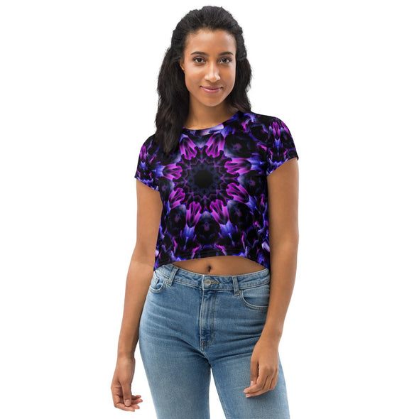 Product Photograph of a unisex Bleace MetaParty Vibes Kaleidoscopic purple, blue, and pink, Trippy Visual crop top tee shirt in the foreground with a white background.