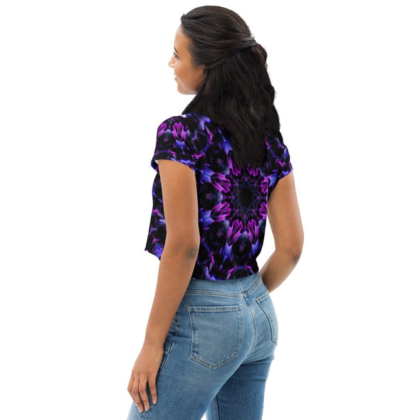 Product Photograph of a unisex Bleace MetaParty Vibes Kaleidoscopic purple, blue, and pink, Trippy Visual crop top tee shirt in the foreground with a white background.