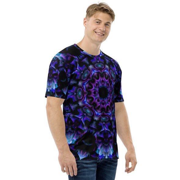 Photograph of a model wearing a unisex Bleace MetaParty Vibes Kaleidoscopic purple, blue, and pink, Trippy Visual tee shirt in the foreground with a white background.  