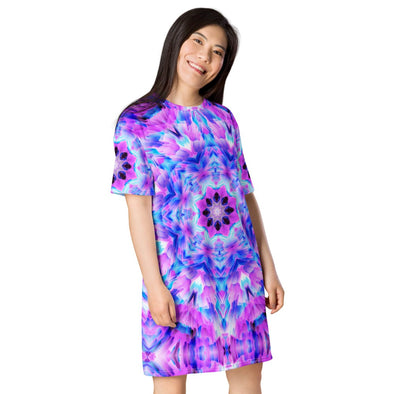 Photograph of a model wearing a Bleace unisex MetaParty Vibes Kaleidoscopic pink, light blue, Trippy Visual tee shirt dress.  