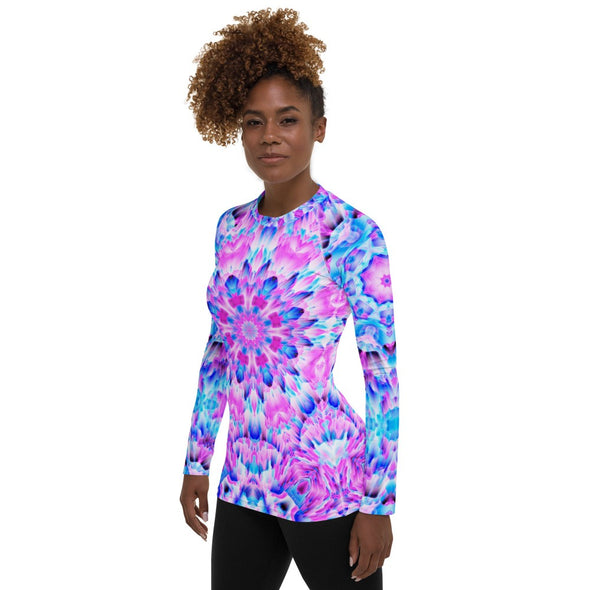 Photograph of a model wearing a unisex Bleace MetaParty Vibes Kaleidoscopic pink, light blue, Trippy Visual Rash guard shirt top.  