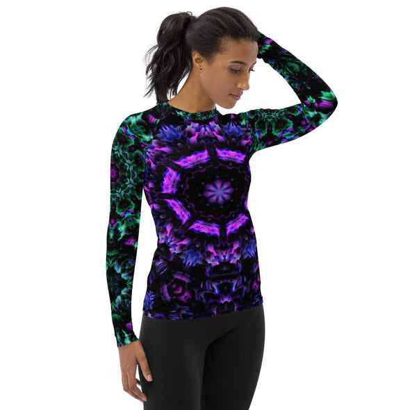 Product Photograph of a unisex Bleace MetaParty Vibes Kaleidoscopic purple, blue, pink, and green Trippy Visual rash guard in the foreground with a white background.