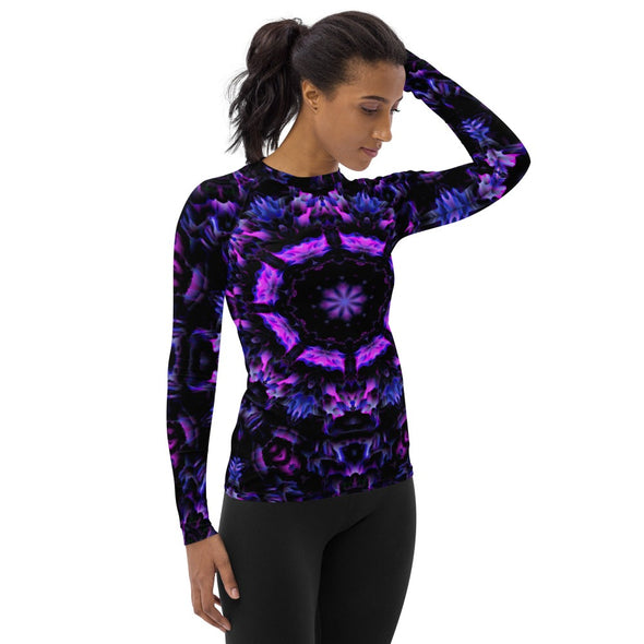 Photograph of a model wearing Bleace unisex MetaParty Vibes Kaleidoscopic purple, blue, and pink, Trippy Visual rash guard.  