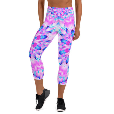 Product Photograph of a unisex Bleace MetaParty Vibes Kaleidoscopic blue, pink and white Trippy Visual yoga capri leggings in the foreground with a white background.