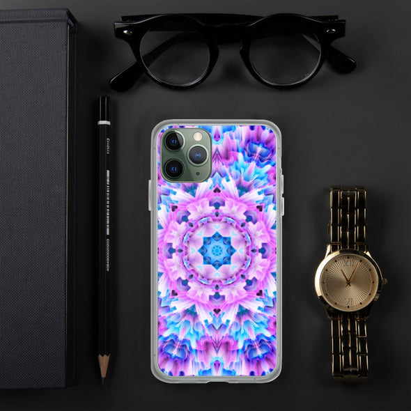 Product photograph of a Bleace Iphone case that has a kaleidoscope image made of pink, blue and purple colors in the foreground against a table backdrop next to a watch and eyeglasses.