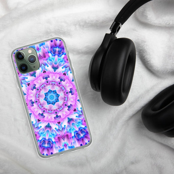 Product photograph of a Bleace Iphone case that has a kaleidoscope image made of pink, blue and purple colors in the foreground against a table backdrop next to a watch and eyeglasses.