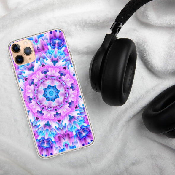 Product photograph of a Bleace Iphone case that has a kaleidoscope image made of pink, blue and purple colors in the foreground against a table backdrop next to a watch and eyeglasses.